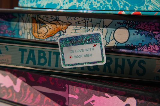 "In love with book men" name tag